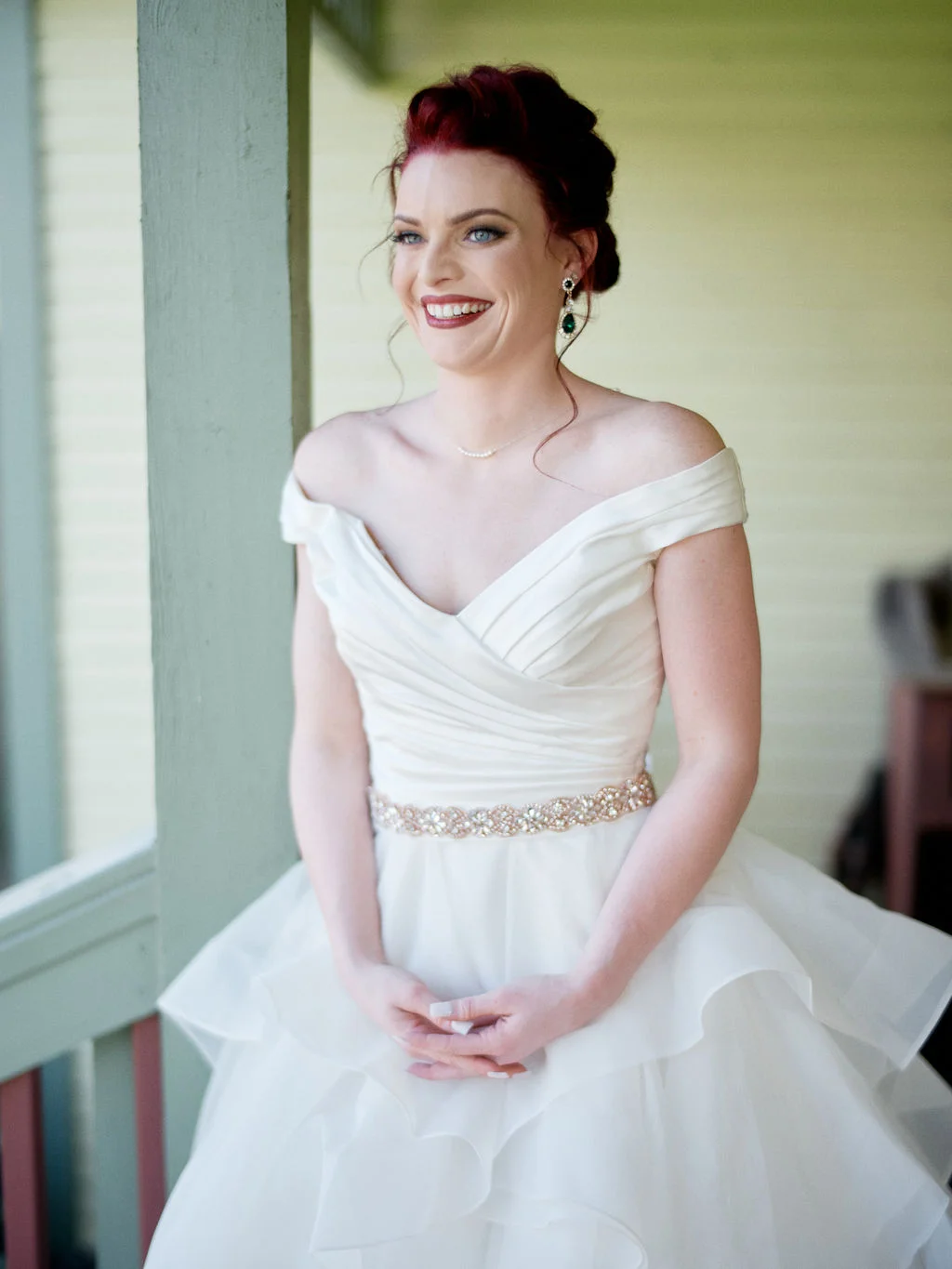 Lauren in her gown on the cottage porch